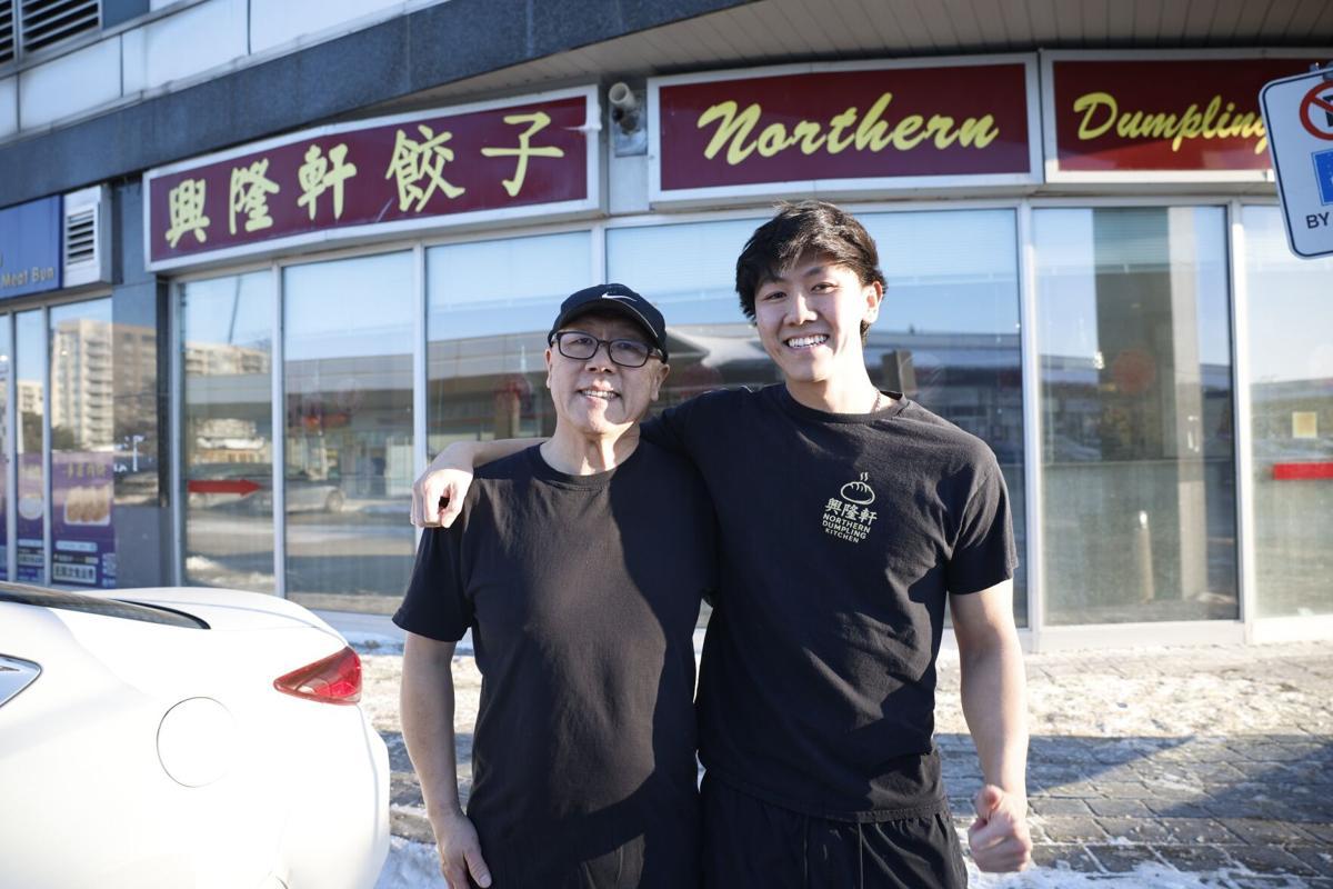 Richard and his father outside the restaurant